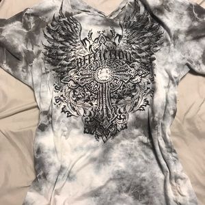 this is brand new . it’s covered in rhinestones and has distressed parts